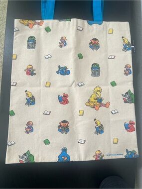 Sesame Street Cream Tote Bag with Multicolor Character Print and Blue Handles